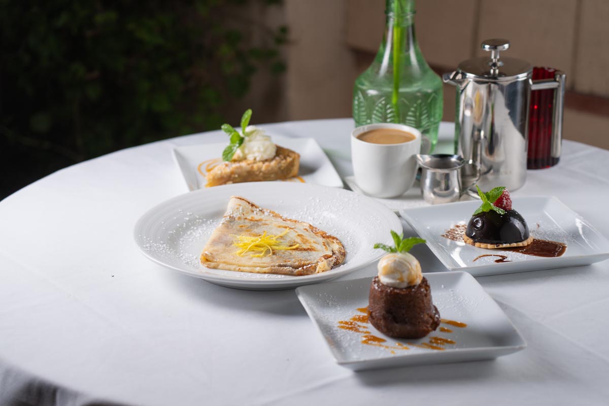 Assorted desserts served on the table with coffee